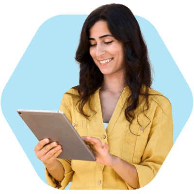 Woman using a tablet, representing a recruiter at a small agency managing work through recruitment software for small agencies